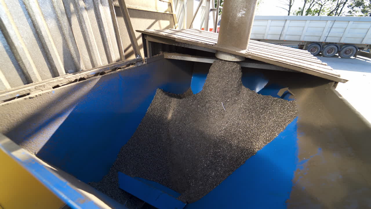 Grains on the industrial plant. Factory for keeping and processing agricultural products. Industrial equipment with compound feed.