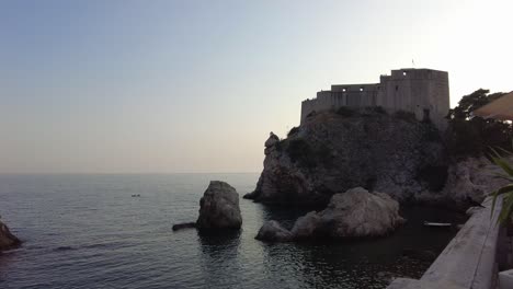 a glimpse of fort bokar in dubrovnik, croatia. this 15th-century coastal fortress is famous for its distinctive cylindrical design and historical significance.