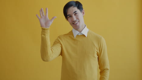 man waving hello