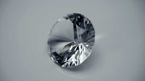 a large, beautiful diamond slides over a white (black) surface