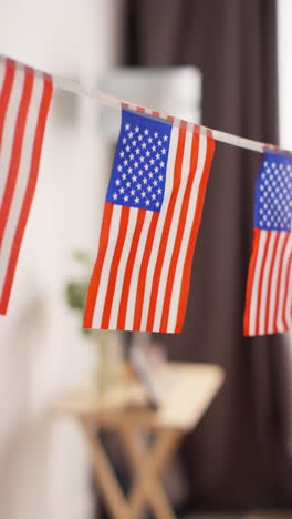 vertical video close up of american stars and stripes flag bunting for party celebrating 4th july independence day 3