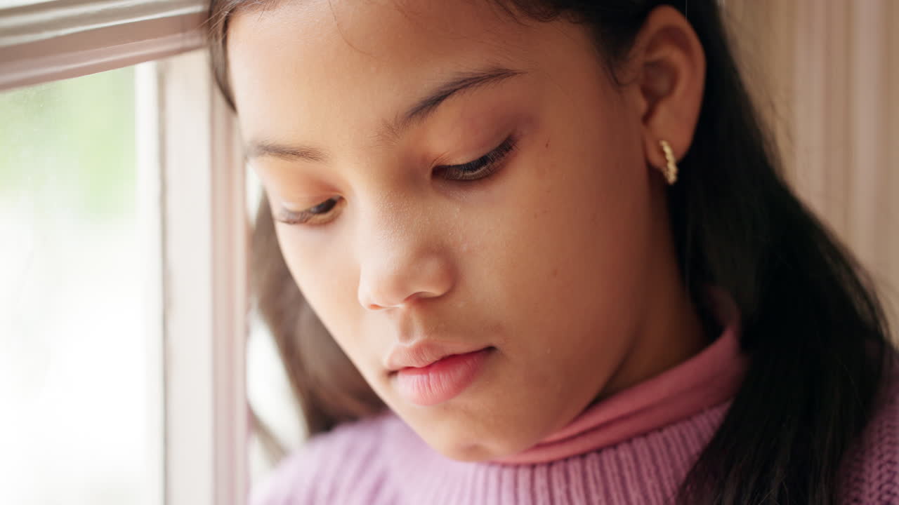 Pensive Girl by the Window