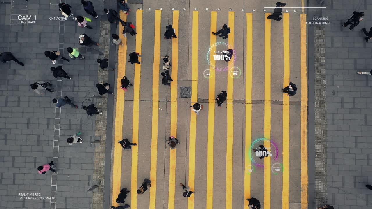 Aerial view of pedestrians crossing a zebra crossing