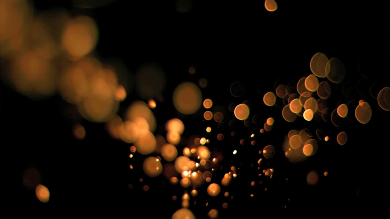 puntos naranjas que fluyen en movimiento súper lento