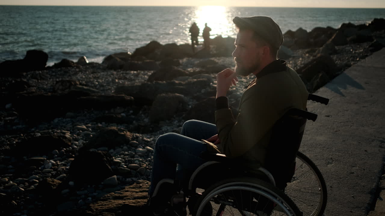 Man in Wheelchair at Sunset Beach