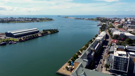 drone aerial shot of hunter river channel inlet newcastle harbour honeysuckle wharf stockton carrington nsw cbd travel tourism coal australia 4k