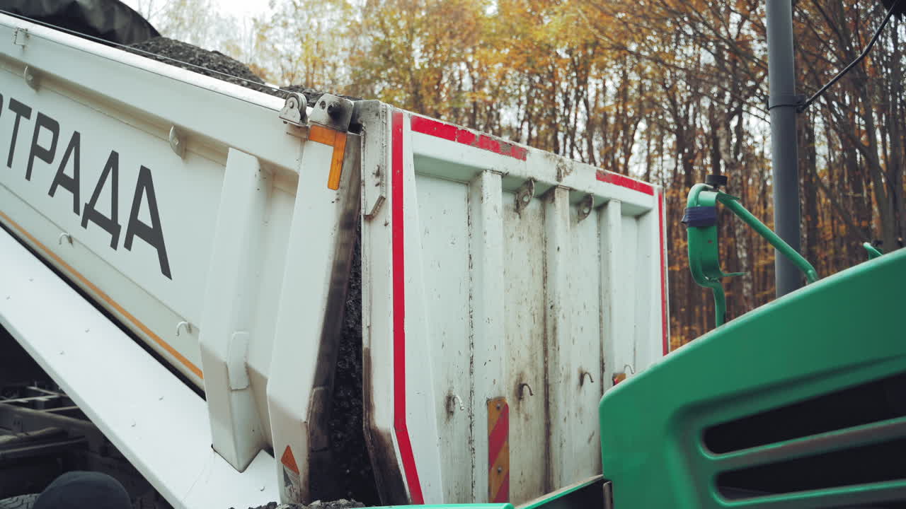 Machine laying asphalt. Machine laying asphalt during highway construction