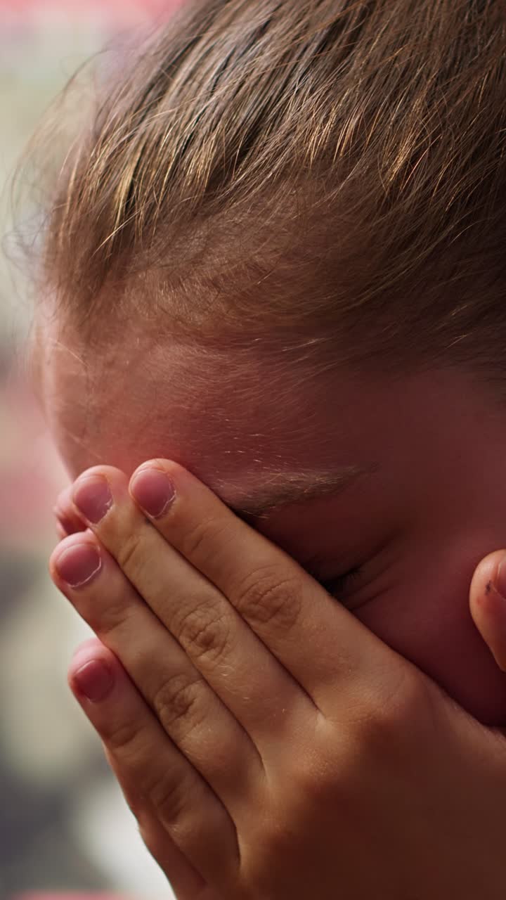 Playful Child Covers Face with Hands and Peeks