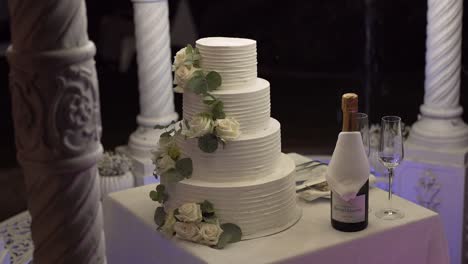 elegant wedding cake with champagne and floral accents