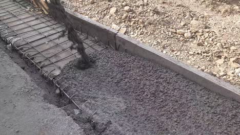 process of installing construction of new sidewalks laying concrete cement