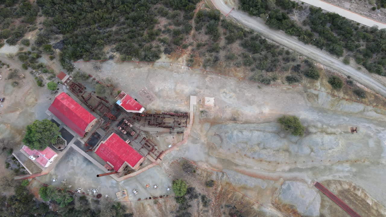 Cenital drone view of Estación 2 Cable Carril’s red-roofed buildings and mining ruins in Chilecito, La Rioja, Argentina