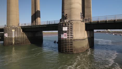 jet ski racing under the kingsferry bridge in kent in south east england