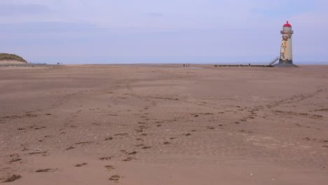 the beautiful point of ayr lighthouse in wales in golden light 1