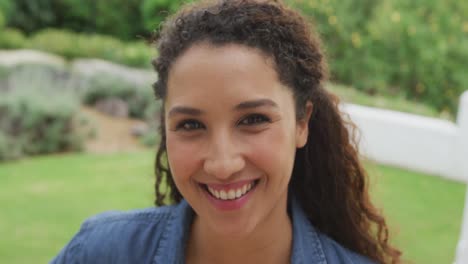 video of happy biracial women smiling in the garden