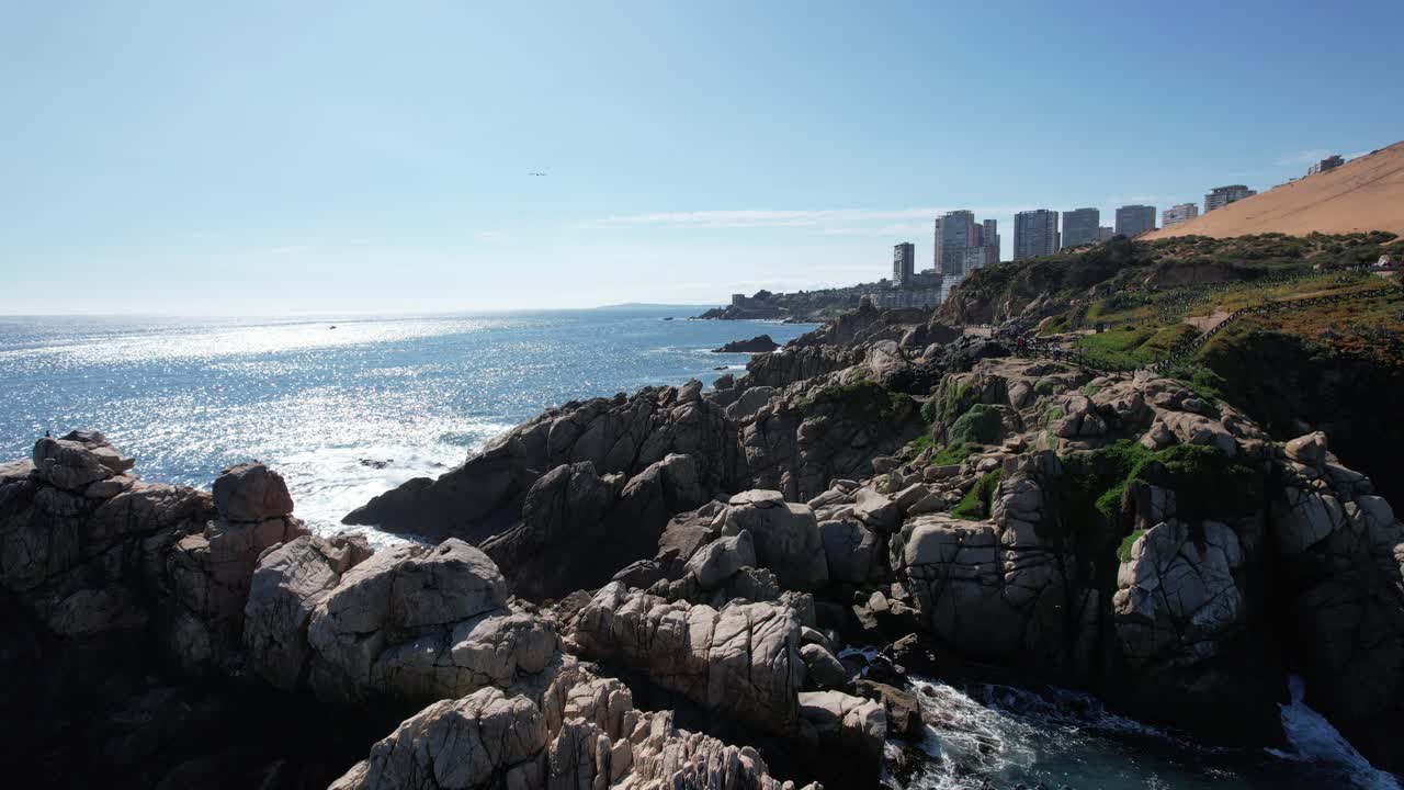 View over the Coastal Cliffs of Vi&ntilde;a del Mar with the Sun Reflection in the Calm Ocean, City landscape and Dunes Vi&ntilde;a del Mar, Chile
