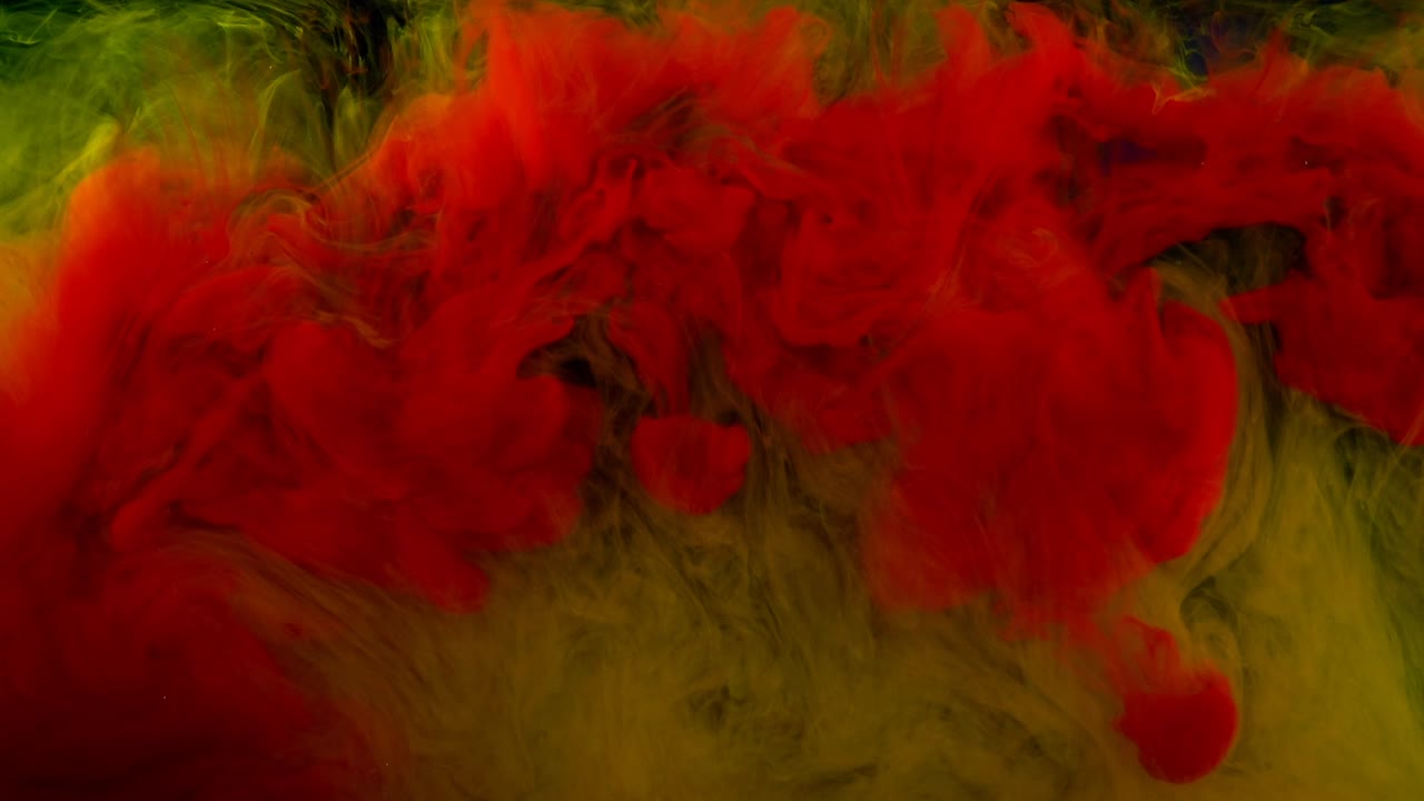 Abstract forms. Shooting on a black background. Mixing of paints