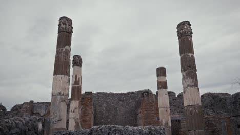 standing columns in pompeii ruins, italy