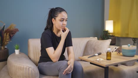 troubled young woman looking at knife and pills in front of her.