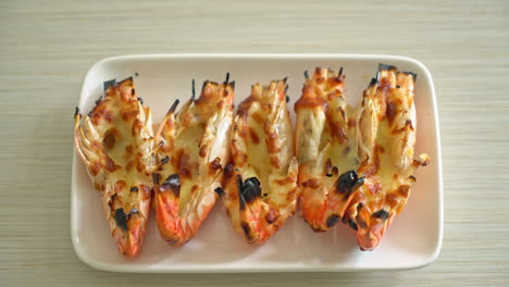 grilled river prawns or shrimps with cheese - seafood style