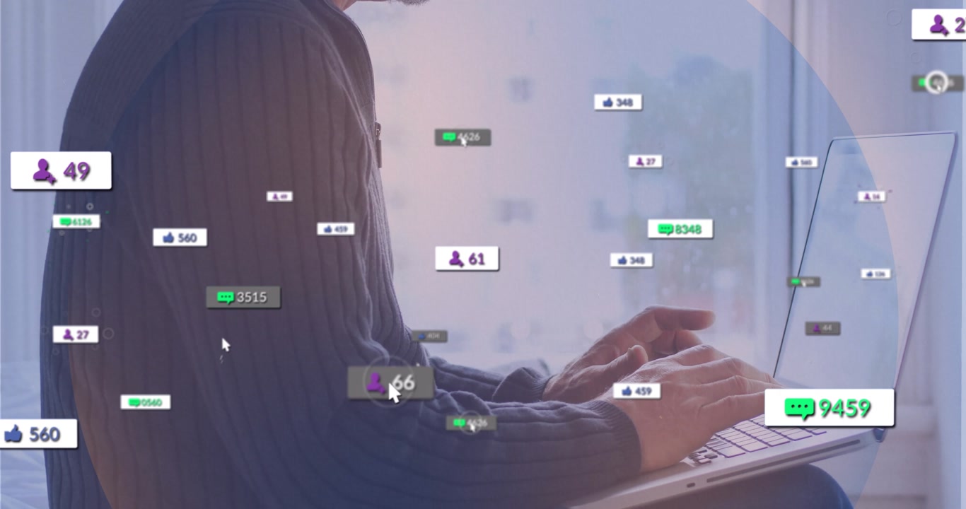 Mature adult man typing on laptop in home workspace, with animated engagement metrics growing