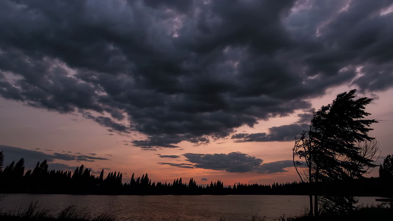 Dramatic Sunset Over a Lake with Storm Clouds