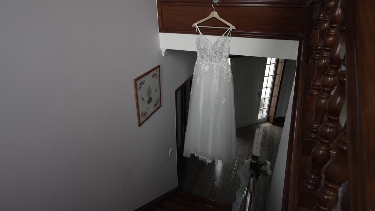 high angle view of a delicate wedding dress in a rustic home