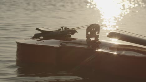 a classic violin is floating on sea water