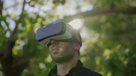 Smiling-man-using-virtual-reality-headset-outdoor