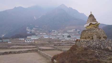 aerial view of phortse village on everest trek route. smokey, unclear atmosphere highlights global warming and calls for nature conservation in nepal trekking trail scenery
