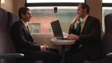 businessman working on a train