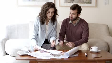 Front-view-of-home-owner-talking-with-interior-designer