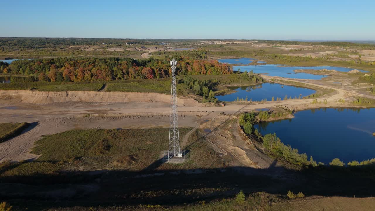 Telecom tower in gravel pit near Caledon, Ontario, captured on sunny day