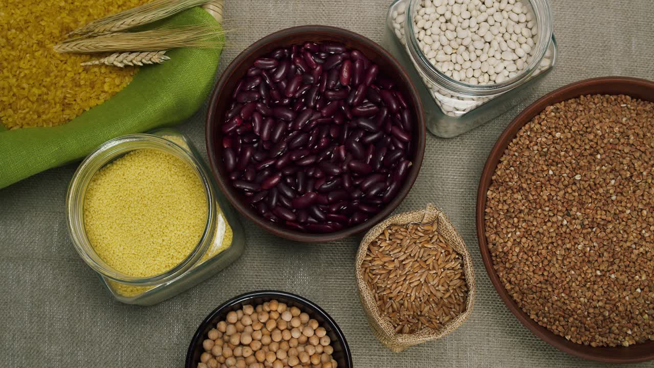Assortment of Healthy Grains and Legumes on Rustic Burlap Background