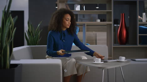 African-american-business-woman-closing-laptop