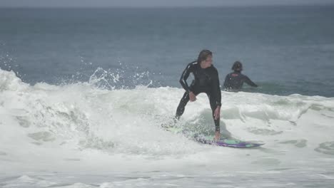 full-speed air reverse above a crumbling lip. the surfer launches high with control, style and tension in the leash mid-rotation, mid-flight, pure surf progression