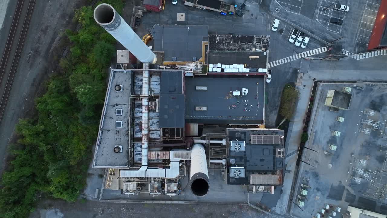 Industrial building with large smokestack pipes and vents