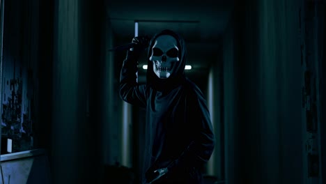 scary figure with a knife in a dark hallway
