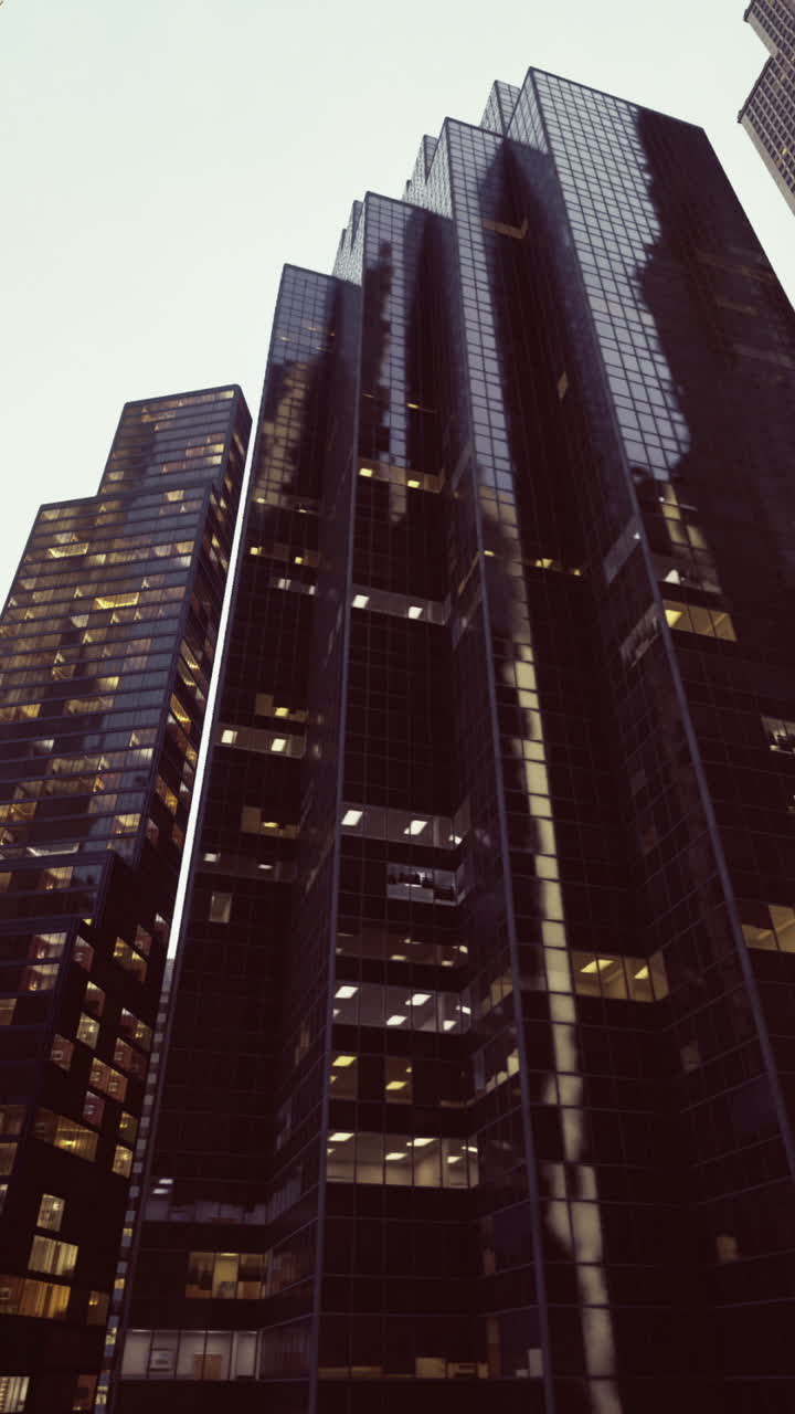 Skyscrapers reach toward the sky in a bustling urban landscape at dusk