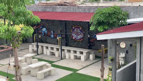 the footage shows the interior of a coffee shop that displays paintings and graffiti on every wall.