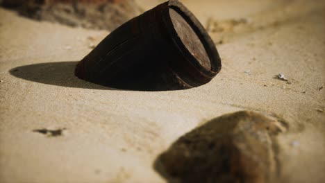 old wooden barrel on the beach