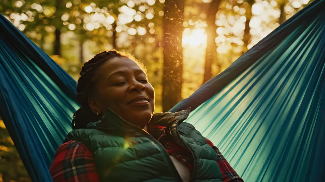 Woman Relaxing in Hammock in Forest