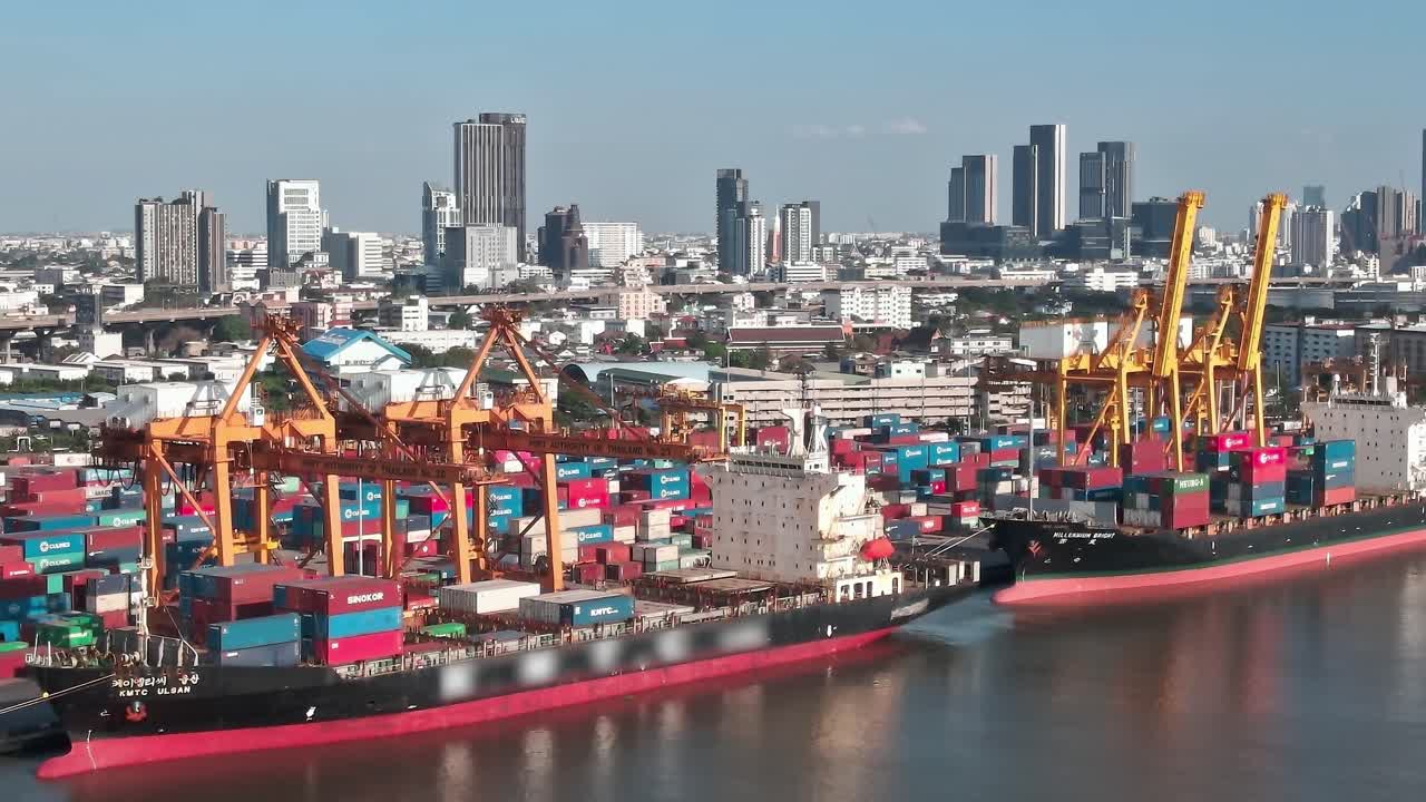Cargo ships dock at busy port in Bangkok during bright daylight hours
