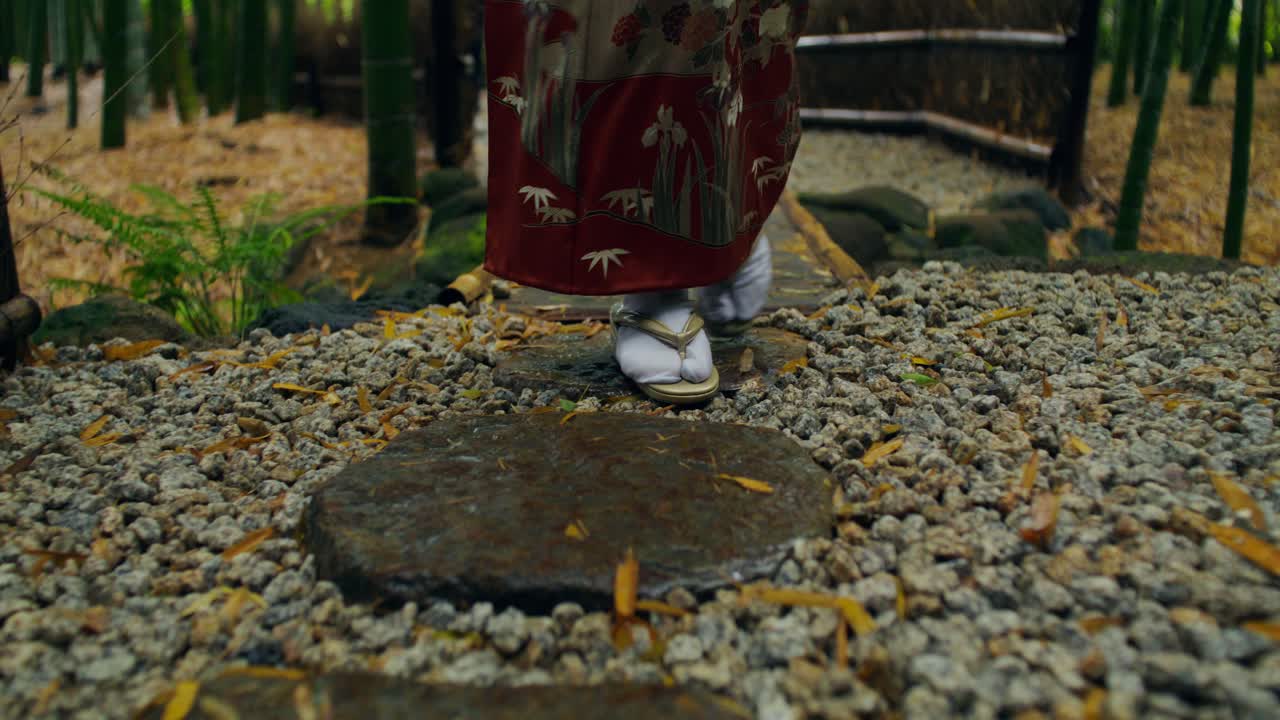 Woman in Kimono Walking in a Japanese Garden