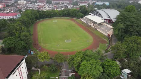 aerial view of a soccer field in a city