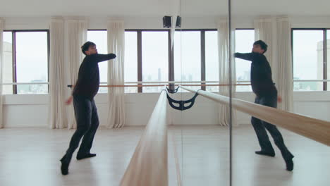 Male Dancer Choreographing Contemporary Dance by Mirror Wall at Studio