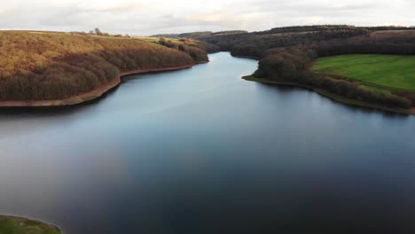 aerial over calm smooth calm wimbleball lake on exmoor in somerset