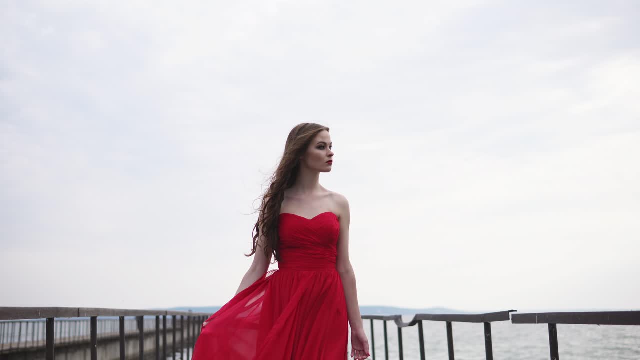 Woman in Red Dress on a Bridge