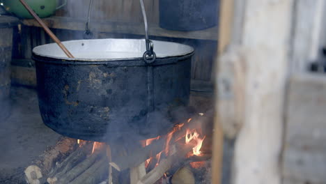 cheese making - the huge pot of sheeps milk over the smokey fire