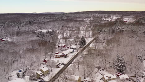 aerial of small new england town covered in snow on a calm winter day