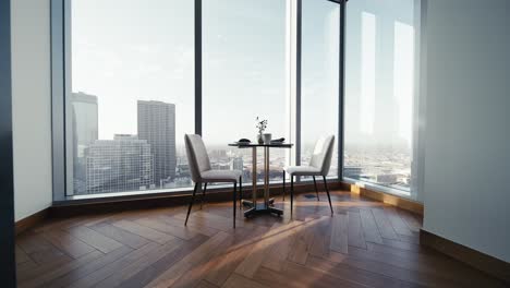 a wide push in shot of a small table set with white chairs on a wooden floor inside of a luxury condo next to large windows